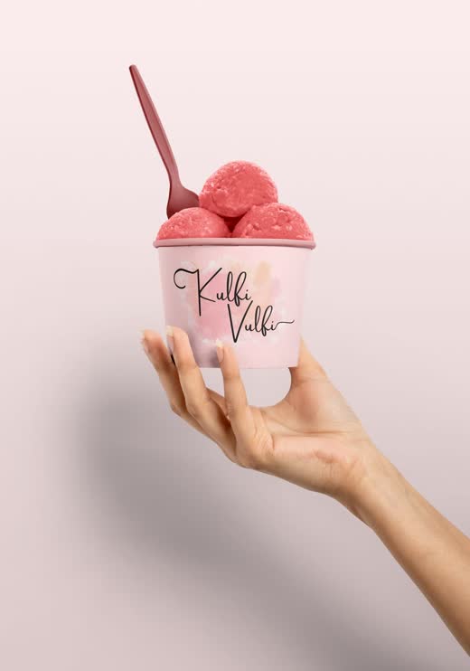 Kulfi Vulfi branded cup held in a hand