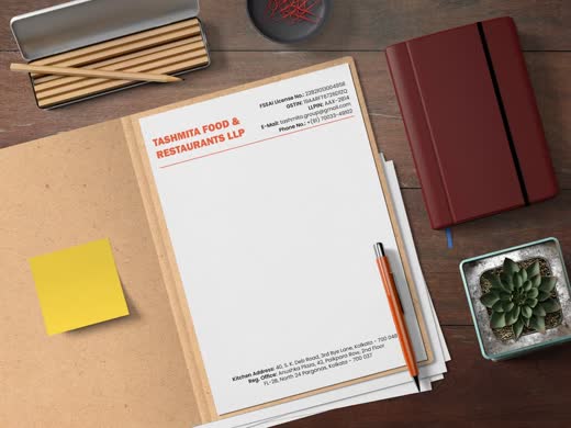 Tanhaita Food and Restaurants letterhead on a desk