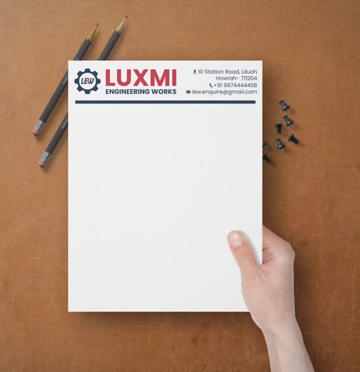 Luxmi Engineering Works notepad held over a desk