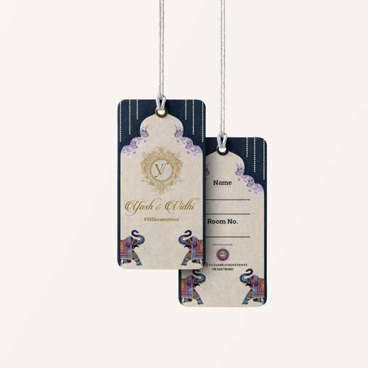 Two wedding luggage tags hanging on strings